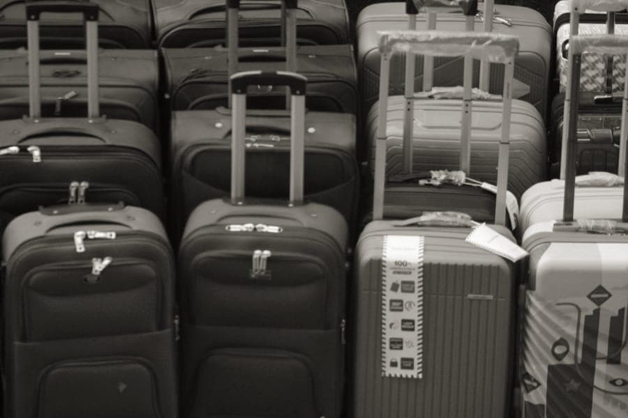 A softside cabin suitcase with the telescoping handle extended